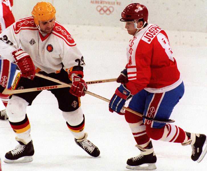 Canada's Fabian Jospeh (right) competing in the hockey event against Germany at the 1992 Albertville Olympic winter Games. (CP PHOTO/COA/Scott Grant)