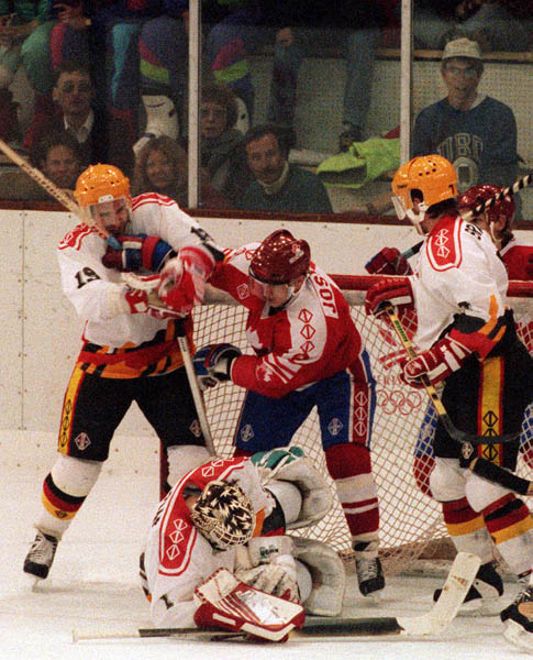 Canada's Fabian Joseph (centre) competing in the hockey event against Germany at the 1992 Albertville Olympic winter Games. (CP PHOTO/COA/Scott Grant)