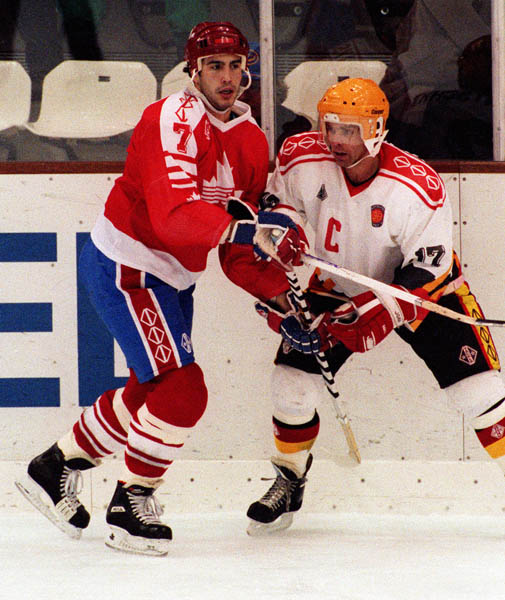 Canada's Adrien Plavsic (left) competing in the hockey event against Germany at the 1992 Albertville Olympic winter Games. (CP PHOTO/COA/Scott Grant)