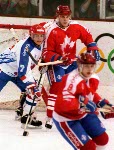 Canada's Chris Lindberg (left) competing in the hockey event against France at the 1992 Albertville Olympic winter Games. (CP PHOTO/COA/Scott Grant)