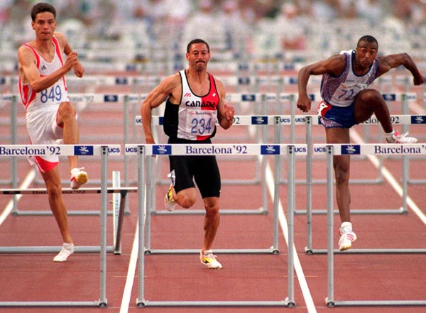 Canada's Mark McKoy competing in the 110m hurdles event at the 1992 Olympic games in Barcelona. (CP PHOTO/ COA/ Claus Andersen)