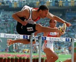 Canada's Mark McKoy celebrates his gold medal win in the 110m hurdles event at the 1992 Barcelona Olympic Games. (CP PHOTO/COA/Claus ANdersen)
