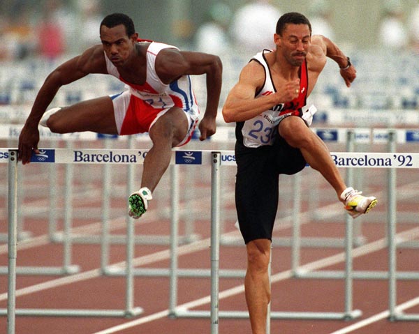 Canada's Mark McKoy (right) competing in the 110m hurdles event at the 1992 Olympic games in Barcelona. (CP PHOTO/ COA/ Claus Andersen)