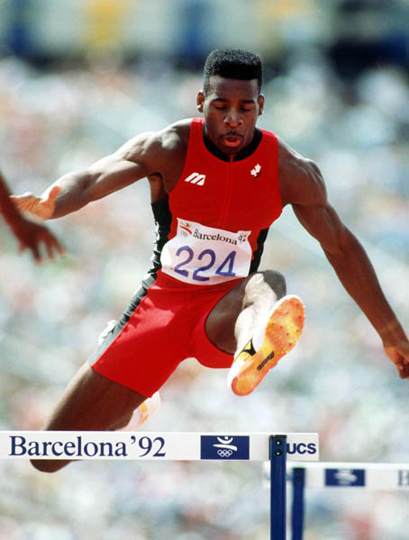 Canada's Mark Jackson competing in the 400m hurdles event at the 1992 Olympic games in Barcelona. (CP PHOTO/ COA/ Claus Andersen)