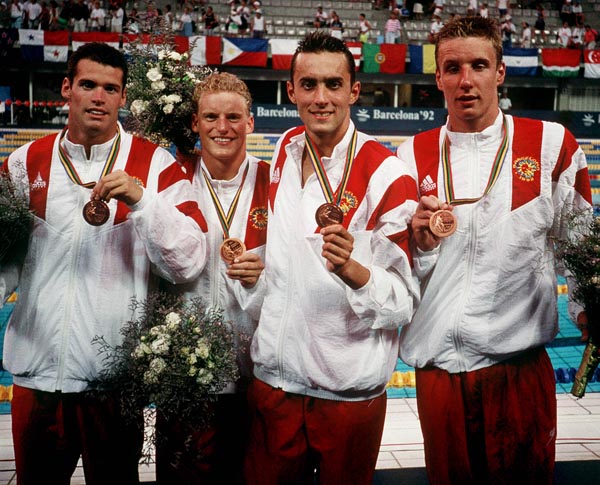 Canada's men's IM team from left to right, Mark Tewksbury, Jon Cleveland, Marcel Gery and Stephen Clarke celebrate their bronze medal win at the 1992 Olympic games in Barcelona. (CP PHOTO/ COA/Ted Grant)