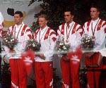 (From left to right) Canada's Mark Tewksbury, Jon Cleveland, Marcel Gery and Stephen Clarke celebrate the bronze medal they won in the men's IM swim event at the 1992 Olympic games in Barcelona. (CP PHOTO/ COA/Ted Grant)
