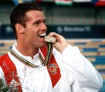 Canada's Mark Tewksbury celebrates his gold medal win in the men's swimming event at the 1992 Olympic games in Barcelona. (CP PHOTO/ COA/Ted Grant)