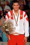 Canada's Jeff Thue celebrates the silver medal he won in the wrestling event at the 1992 Olympic games in Barcelona. (CP PHOTO/ COA/ Ted Grant)