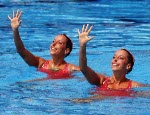 Canada's Penny and Vicky Vilagos, identical twins, competing in the synchronized swimming event at the 1992 Olympic games in Barcelona. (CP PHOTO/ COA/ Ted Grant)