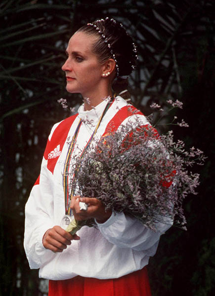 Canada's Sylvie Frchette celebrates the silver medal she won in the synchronized swimming event at the 1992 Olympic games in Barcelona. Due to a judging error at the games, Sylvie was later awarded the gold medal (CP PHOTO/ COA/ Ted Grant)