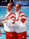 Canada's Penny and Vicky Vilagos, identical twins, competing in the synchronized swimming event at the 1992 Olympic games in Barcelona. (CP PHOTO/ COA/ Ted Grant)