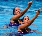 Canada's Penny and Vicky Vilagos, identical twins, competing in the synchronized swimming event at the 1992 Olympic games in Barcelona. (CP PHOTO/ COA/ Ted Grant)