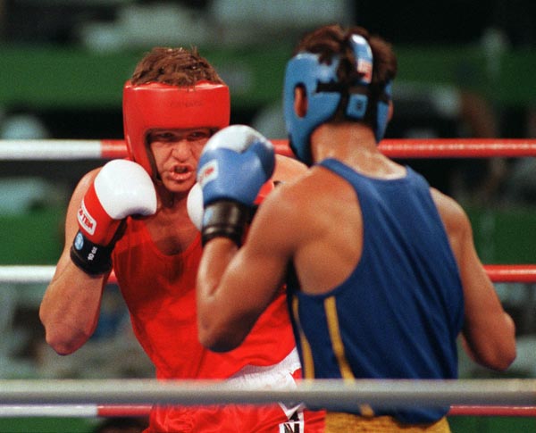 Canada's Dale Brown (left) competing in the boxing event at the 1992 Olympic games in Barcelona. (CP PHOTO/ COA/ F.S.Grant)