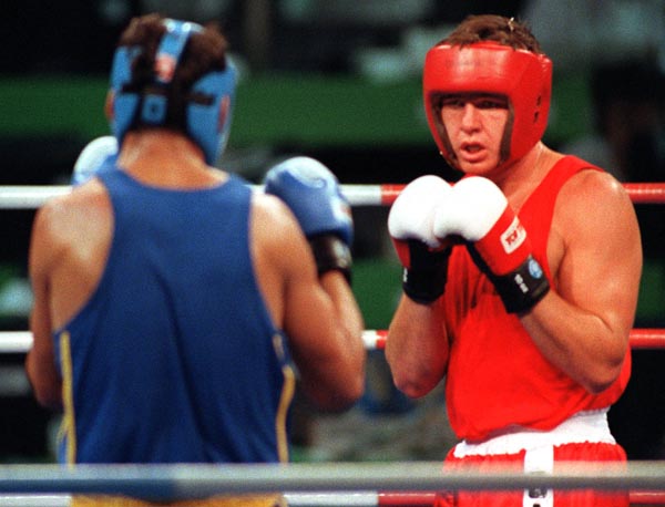 Canada's Dale Brown (right) competing in the boxing event at the 1992 Olympic games in Barcelona. (CP PHOTO/ COA/ F.S.Grant)
