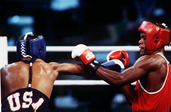 Canada's Chris Johnson (right) competing in the boxing event at the 1992 Olympic games in Barcelona. (CP PHOTO/ COA/ F.S.Grant)