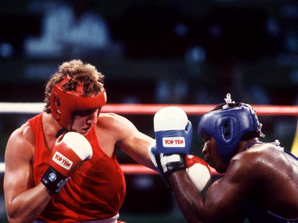 Canada's Tom Glesby (left) competing in the boxing event at the 1992 Olympic games in Barcelona. (CP PHOTO/ COA/ F.S.Grant)