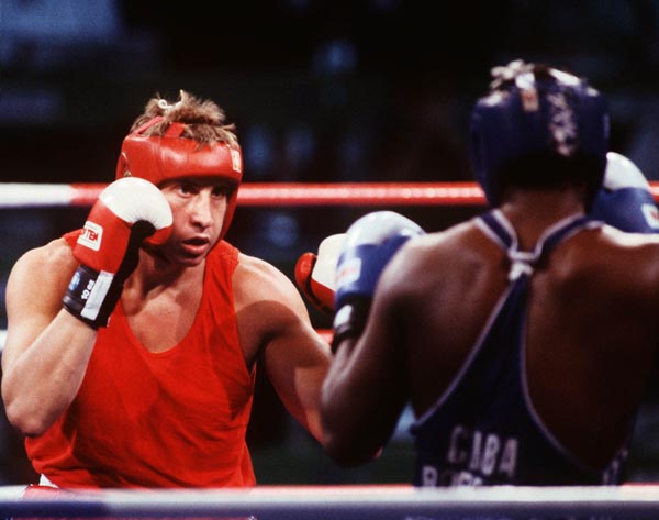 Canada's Tom Glesby (left) competing in the boxing event at the 1992 Olympic games in Barcelona. (CP PHOTO/ COA/ F.S.Grant)