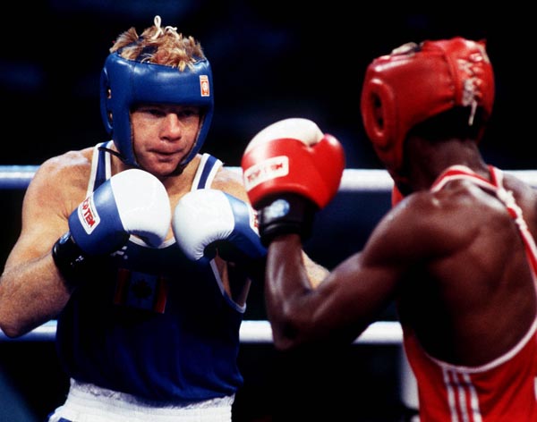 Canada's Mark Leduc (left) competing in the boxing event at the 1992 Olympic games in Barcelona. (CP PHOTO/ COA/ F.S.Grant)