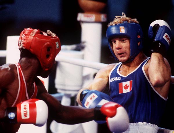Canada's Mark Leduc (right) competing in the boxing event at the 1992 Olympic games in Barcelona. (CP PHOTO/ COA/ F.S.Grant)