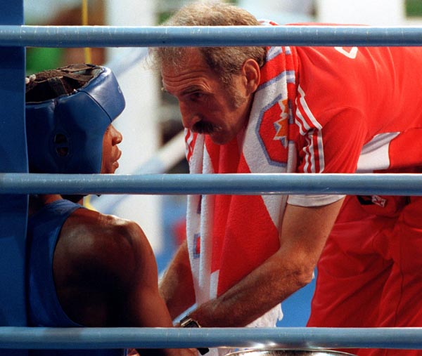 Canada's Chris Johnson (left) and his coach Arnie Boehm competing in the boxing event at the 1992 Olympic games in Barcelona. (CP PHOTO/ COA/ F.S.Grant)