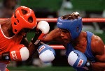 Canada's Chris Johnson (left) competing in the boxing event at the 1992 Olympic games in Barcelona. (CP PHOTO/ COA/ F.S.Grant)