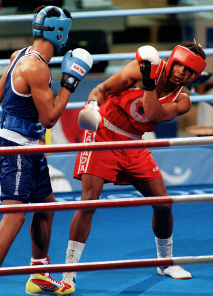 Canada's Raymond Downey (right) competing in the boxing event at the 1992 Olympic games in Barcelona. (CP PHOTO/ COA/ F.S.Grant)