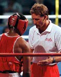 Canada's Raymond Downey (right) and his coach Taylor Gordon competing in the boxing event at the 1992 Olympic games in Barcelona. (CP PHOTO/ COA/ F.S.Grant)
