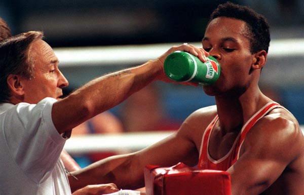 Canada's Raymond Downey (right) and his coach Taylor Gordon competing in the boxing event at the 1992 Olympic games in Barcelona. (CP PHOTO/ COA/ F.S.Grant)