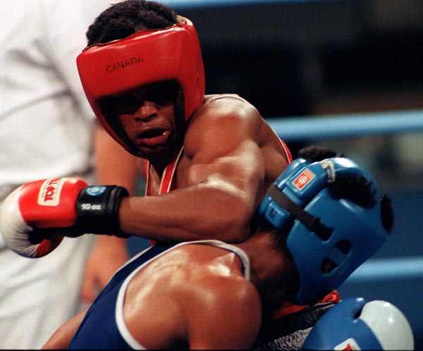 Canada's Raymond Downey (red) competing in the boxing event at the 1992 Olympic games in Barcelona. (CP PHOTO/ COA/ F.S.Grant)
