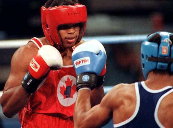 Canada's Raymond Downey (left) competing in the boxing event at the 1992 Olympic games in Barcelona. (CP PHOTO/ COA/ F.S.Grant)