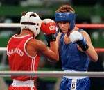 Canada's Tom Glesby (red) competing in the boxing event at the 1992 Olympic games in Barcelona. (CP PHOTO/ COA/ F.S.Grant)