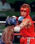 Canada's Tom Glesby (red) competing in the boxing event at the 1992 Olympic games in Barcelona. (CP PHOTO/ COA/ F.S.Grant)