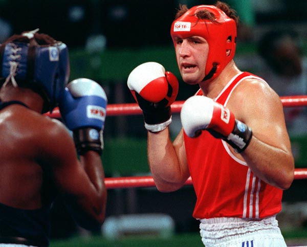 The Unified Team's N. Koulpine (right) competing in the boxing event at the 1992 Olympic games in Barcelona. (CP PHOTO/ COA/ F.S.Grant)