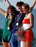 Canada's Silken Laumann (right) celebrates her bronze medal win with gold medal winner Elisabeta Lipa of Romania (centre) and silver medal winner Annelies Bredael (left) of Belgium in the 1x rowing event at the 1992 Olympic games in Barcelona. (CP PHOTO/