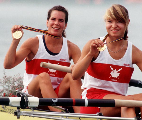 Canada's Marnie McBean (left) and Kathleen Heddle celebrate their gold medal win in the 2- rowing event at the 1992 Olympic games in Barcelona. (CP PHOTO/ COA/Ted Grant)