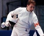 Canada's Jean-Marc Chouinard (right) competes in the fencing event at the 1996 Atlanta Summer Olympic Games. (CP Photo/ COA/F. Scott Grant)
