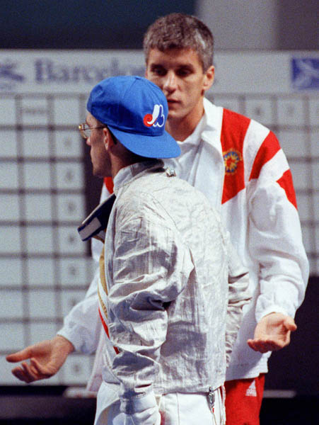 Canada's Tony Plourde (left) competing in the fencing event at the 1992 Olympic games in Barcelona. (CP PHOTO/ COA/ T.Grant)