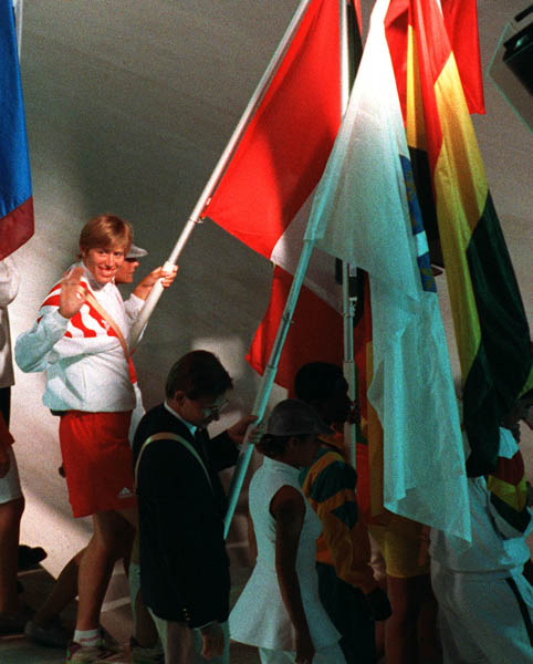 Canada's Silken Laumann carries the Canadian Flag during the closing ceremonies at the 1992 Olympic games in Barcelona. (CP PHOTO/ COA/ Claus Andersen)