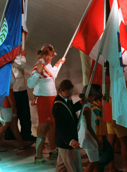 Canada's Silken Laumann carries the Canadian Flag during the closing ceremonies at the 1992 Olympic games in Barcelona. (CP PHOTO/ COA/ Claus Andersen)