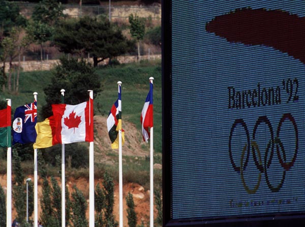 The Canadian flag flutters in the wind at the 1992 Olympic games in Barcelona. (CP PHOTO/ COA/ Claus Andersen)