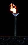 The Olympic Flame burns brightly above the crowd at the 1992 Olympic games in Barcelona. (CP PHOTO/ COA/ Claus Andersen)