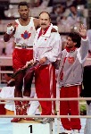 Canada's Lennox lewis celebrates his gold medal win in the boxing event with his coaches Adrian Teodorescu (centre) and Asif Dar (right) at the 1988 Olympic games in Seoul. (CP PHOTO/ COA/ S.Grant)