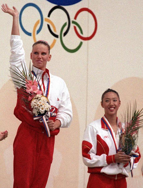 Canada's Carolyn Waldo (left) celebrates her gold medal win in the synchronized swimming event at the 1988 Olympic games in Seoul. (CP PHOTO/ COA/ Ted Grant)