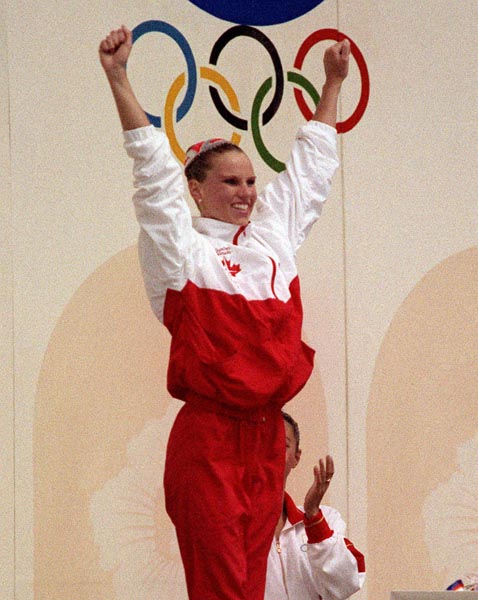 Canada's Carolyn Waldo celebrates her gold medal win in the synchronized swimming event at the 1988 Olympic games in Seoul. (CP PHOTO/ COA/ Ted Grant)