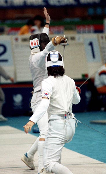 Canada's Marie-Huguette Cormier (left) competing in the fencing  event at the 1988 Olympic games in Seoul. (CP PHOTO/ COA/ T. O'Lett)