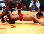 Canada's Gary Holmes (behind) competing in the wrestling event at the 1988 Olympic games in Seoul. (CP PHOTO/ COA/ Cromby McNeil)