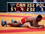 Canada's Lawrence Holmes (red) competing in the wrestling event at the 1988 Olympic games in Seoul. (CP PHOTO/ COA/ Cromby McNeil)