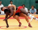 Canada's Gary Holmes and his coaches Jim Miller (left) and Nick Cipriano competing in the wrestling event at the 1988 Olympic games in Seoul. (CP PHOTO/ COA/ Cromby McNeil)