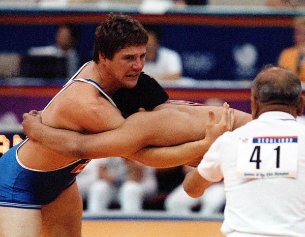Canada's Doug Cox (blue) competing in the wrestling event at the 1988 Olympic games in Seoul. (CP PHOTO/ COA/ Cromby McNeil)