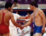 Canada's Doug Cox (blue) and his coach Victor Zilberman competing in the wrestling event at the 1988 Olympic games in Seoul. (CP PHOTO/ COA/ Cromby McNeil)